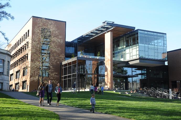 people walking near Paccar Hall University of Washington during daytime